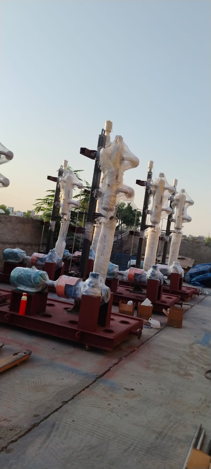 A series of skid-mounted vertical pump units prepared for dispatch, complete with motors, piping, and protective wrapping. Designed for modular installation, these systems ensure uniform quality, faster commissioning, and reduced on-site work.