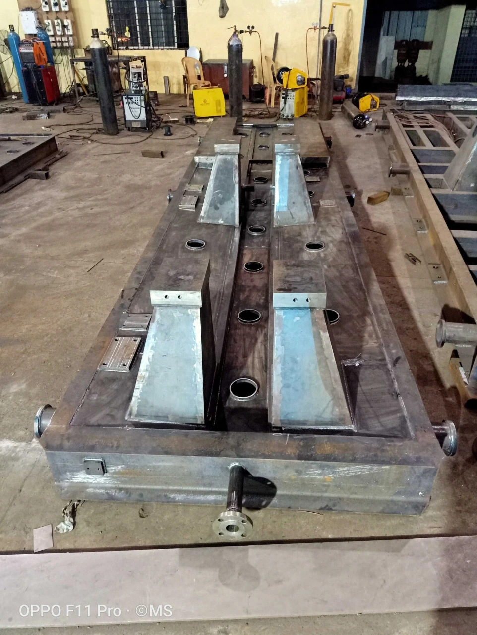 A robust, precision-fabricated equipment base frame designed to support heavy rotating and static machinery. Manufactured using thick steel plates with reinforced stiffeners and inspection openings, ensuring high load-bearing capacity, vibration control, and long-term structural stability for industrial installations.