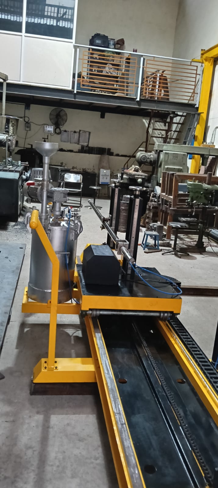 A purpose-built linear processing and assembly machine designed for precision handling, alignment, and controlled movement of industrial components. The system features a rigid steel frame, guided rail track, powered drive mechanism, and integrated safety guarding. Ideal for automated or semi-automated production processes requiring accuracy, repeatability, and operator safety.